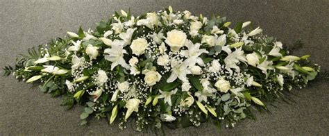 The best way to determine what the displacement of an individual's cremains are is to open the top of the temporary cremation urn (or if. White Coffin Flowers - buy online or call 01206 843461
