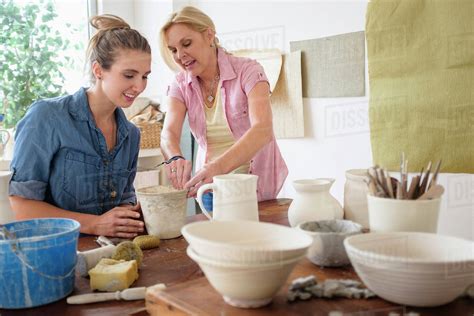 Two Women Making Pottery In Studio Stock Photo Dissolve