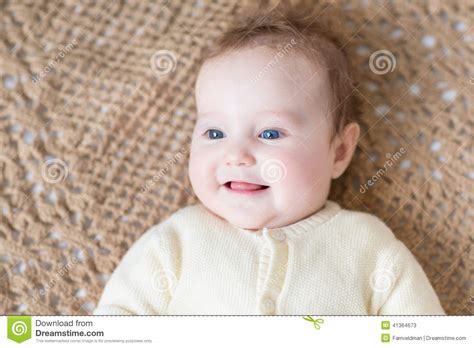 Cute Little Baby With Blue Eyes Wearing Warm Sweater Stock