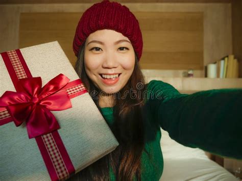 Young Beautiful And Happy Asian Chinese Woman Taking Selfie Picture