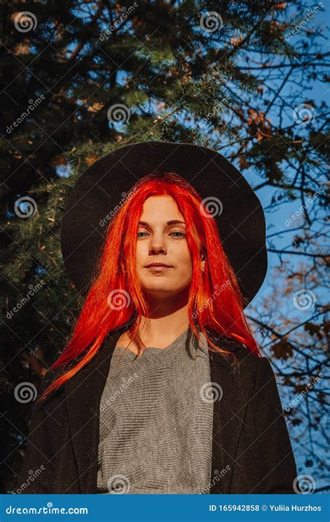 Beautiful Redhead Girl With Long Strong And Thick Hair In A Black Hat