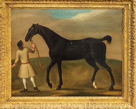 A Dark Bay Racehorse Held By A Groom