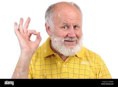 Senior Funny Bald Man In Yellow T Shirt Is Shows Gestures And Grimaces