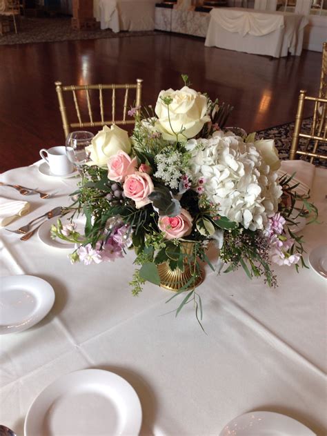 Elegant Gold Urn Arrangements With Roses And Hydrangea