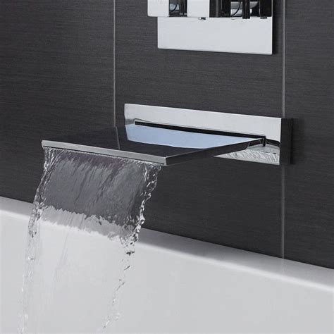 Double cross handles enhance the sleek design of the faucet body with simple curvaceous lines. Waterfall Tub Faucet | Waterfall tub faucet, Bathtub ...