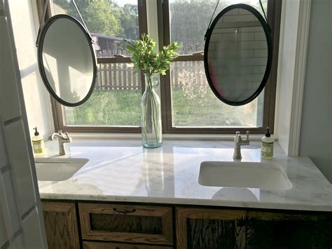 A perfect solution to my window sill problem, i love this! Hanging bathroom mirrors in front of window, marble top ...