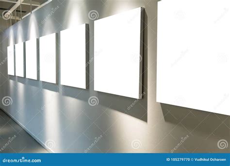 Empty Art Gallery With Blank Posters Hanging On The Walls Stock Photo