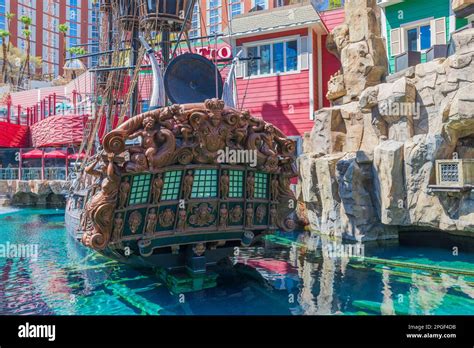 Beautiful View Of Colorful Decorated Pond With Pirate Ship Near Hotel