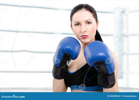 Portrait Of A Beautiful Young Woman In Boxing Gloves Stock Photo