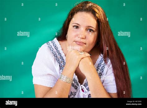 Cuban People And Emotions Portrait Of Sad Overweight Latina Looking At Camera Depressed Fat
