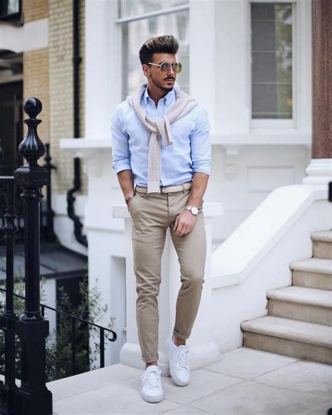 This smart casual men summer implies a relaxed and strict attitude towards ones own look. Light blue shirt, sweater, brown chinos pants, woven belt ...