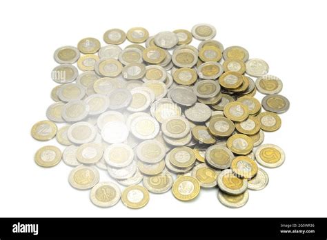 Coins Of Different Countries And Different Denominations On A White