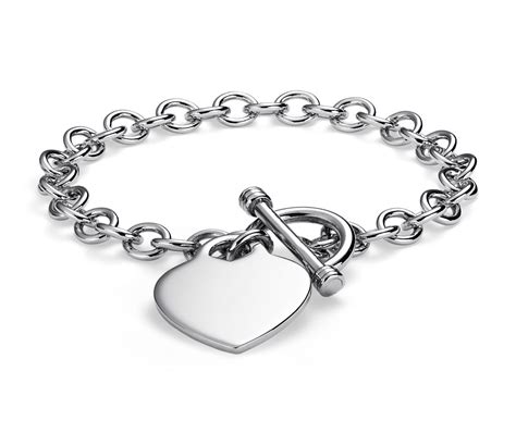 Bangle bracelets have a timeless look, and you can customize them with the charm of your choice. Heart-Tag Toggle Bracelet in Sterling Silver | Blue Nile