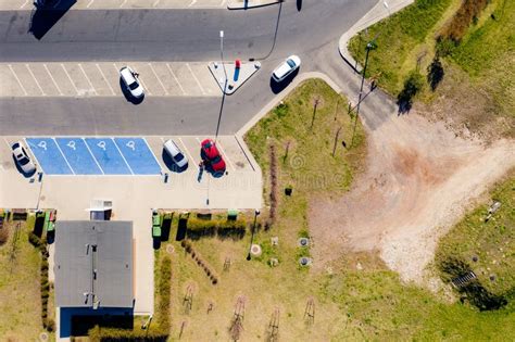 Top View Of The Parking With Cars Roadside Building In The Afternoon