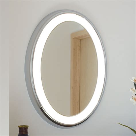 Oval bathroom mirrors provide a nice touch in any bathroom because the shape will often catch your eye more so than a rectangle mirror. Tech Lighting Tigris Oval Bath Mirror | Wayfair