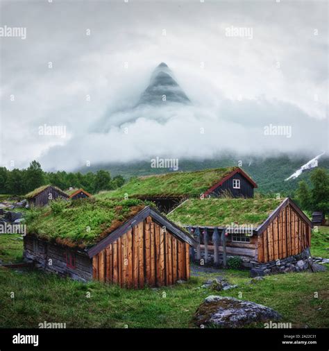 Norwegian Old Wooden Fishing Houses With Grass Roofs In Innerdalen