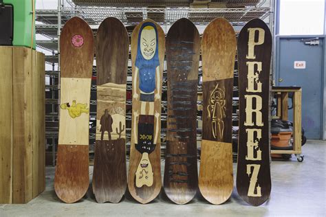 Several Snowboards Are Lined Up In A Row On Display At The Stores Showroom