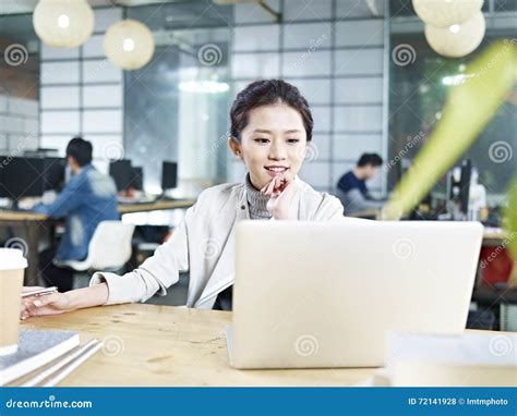 Young Asian Businesswoman Working In Office Stock Photo Image Of