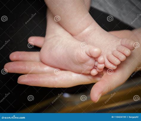 Feet Of Newborn Baby In The Hand Of Mother Stock Image Image Of Hand