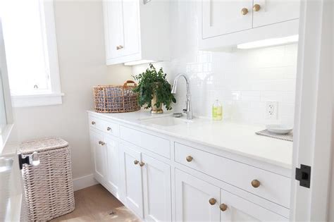 Satin nickel is the most popular nickel finish. White Laundry Room Cabinets with Brushed Brass Octagon ...