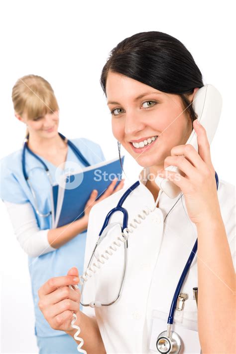 Medical Team Doctor And Nurse Communicating Via Phone Royalty Free