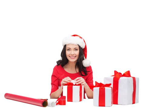 Woman With Santas Helper Hats Packing Ts With A Cheerful Smile
