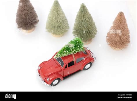 Vintage red car decor with Christmas Tree. Transporting Christmas tree