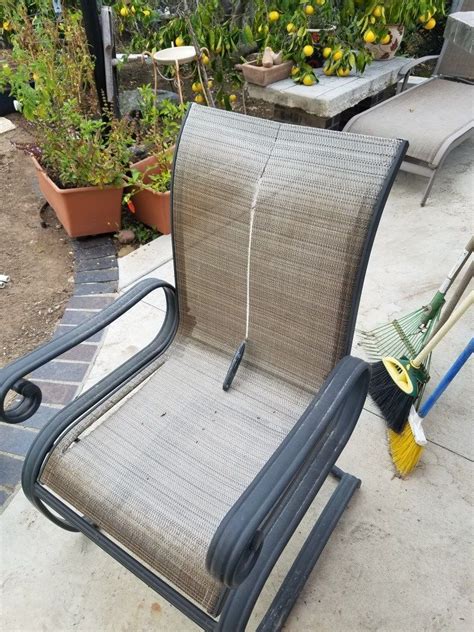 A Lawn Chair Sitting On Top Of A Patio