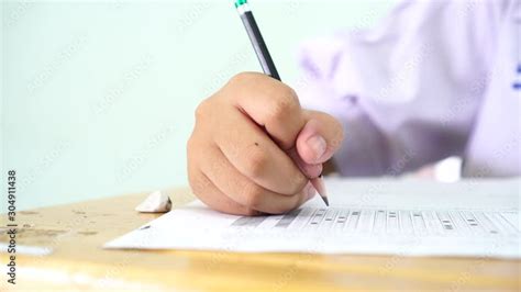 Teen Young Asian Students Group Concentrate Ones Mind Writing Test In