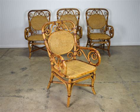 Set Of Four Exceptional Vintage Rattan Dining Arm Chairs With Thonet