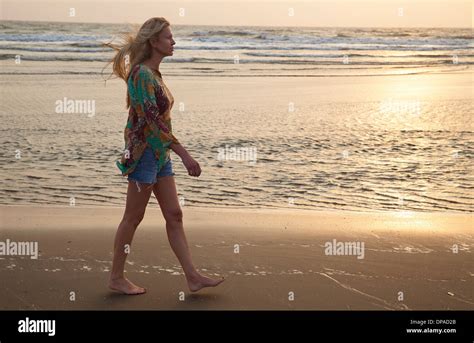 Woman Alone Walking Beach Hi Res Stock Photography And Images Alamy
