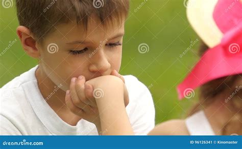 Little Boy Kisses The Girl S Hand And Looks At It Slow Motion Stock