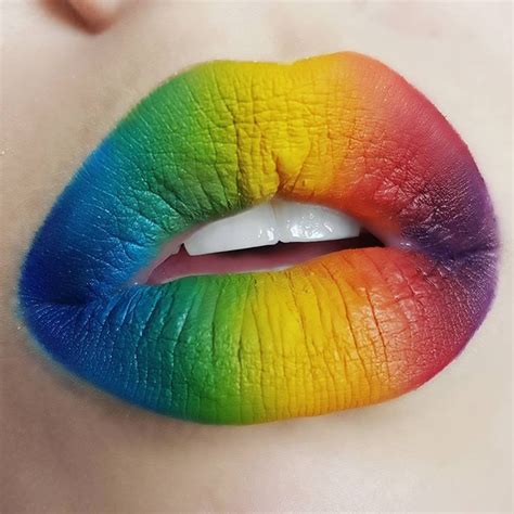 A Woman S Lips Are Painted In Rainbow Colors