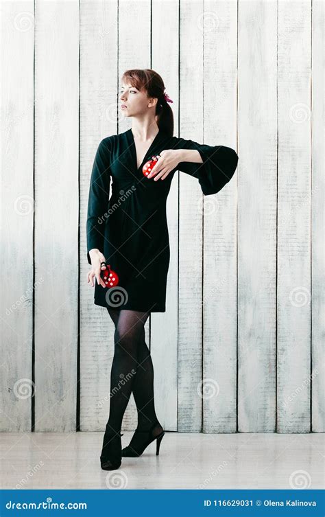 A Young Dancing Girl In Black Dress With Red Castanets Light B Stock