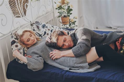 Attractive Man And Woman In The Bedroom Together Cuddling Cute Stock