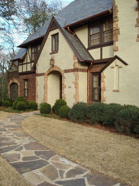 20 Tudor Style Homes To Swoon Over Tudor Style Homes Stucco Exterior