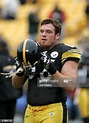 Alan Faneca of the Pittsburgh Steelers puts his helmet on before the ...