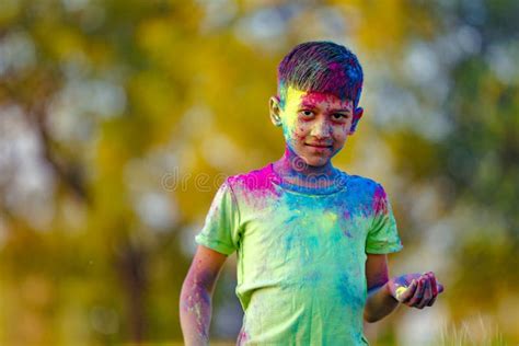 Indian Child Playing With The Color In Holi Festival Stock Image