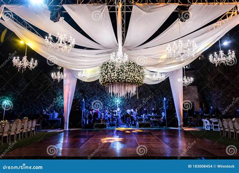 Beautiful Shot Of An Elegant Outdoor Wedding Reception At Night Stock