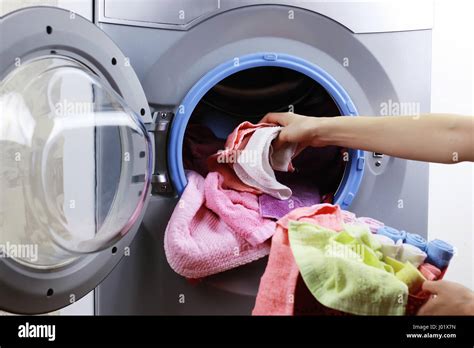 Put Cloth In Washer Stock Photo Alamy