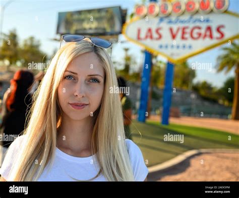 portrait of a gorgeous blonde woman on the las vegas strip standing under the world famous