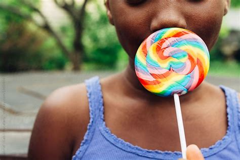 African American Girl With Rainbow Lollipop By Gabriel Gabi Bucataru Rainbow Lollipops