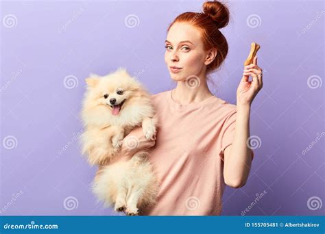 Awesome Attractive Pet Owner Going To Give A Bone To Her Favourite Dog