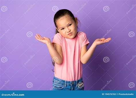 Confused Puzzled Asian Kid Shrugging At Studio Stock Image Image Of