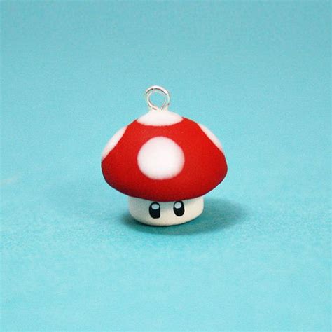 A Red And White Mushroom Sitting On Top Of A Blue Surface