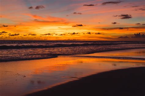 Sunset On The Ocean Beautiful Bright Sky Reflection In