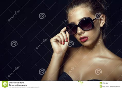 Gorgeous Glam Tanned Model Wearing Trendy Classic Sunglasses Stock