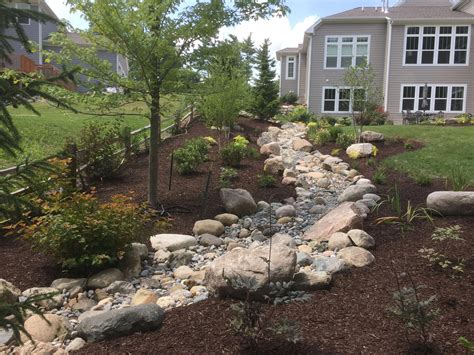 Back Yard Landscape With Dry River Bed For Aesthetically Pleasing Way