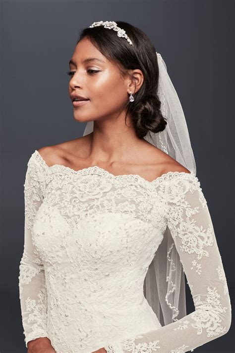 A Timeless Bridal Look A Low Twisted Bun Mid Length Veil And Crystal