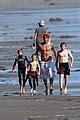 David Beckham Shirtless Boogie Boarding With The Boys Photo